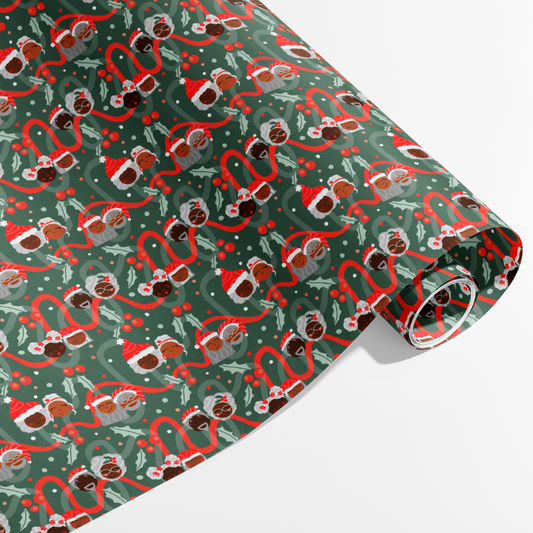 Rolls of Black Santa Wrapping Paper featuring vibrant, festive designs showcasing Black Santa Claus, perfect for Christmas gifts.