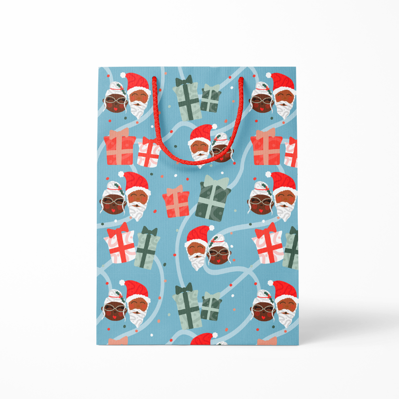 Close-up of Mr. & Mrs. Claus gift bag holiday details and handles